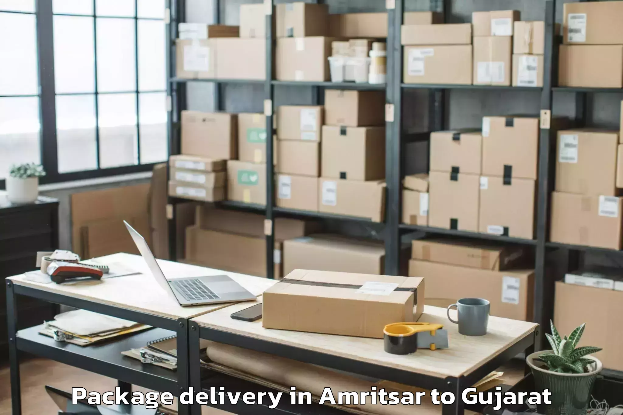 Book Amritsar to Crystal Mall Rajkot Package Delivery Online